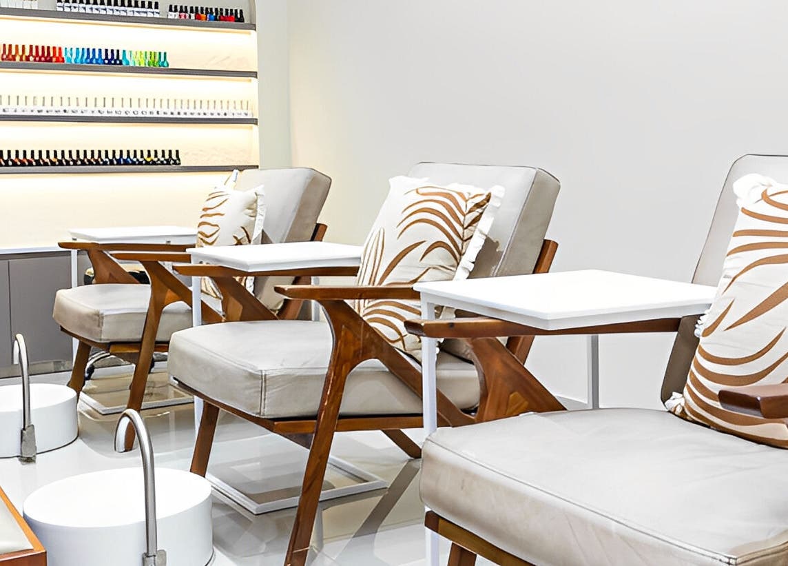 Elegant pedicure seating at Maja Beauty Bar, Dubai, Dubai, AE, featuring plush chairs and stylish decor.