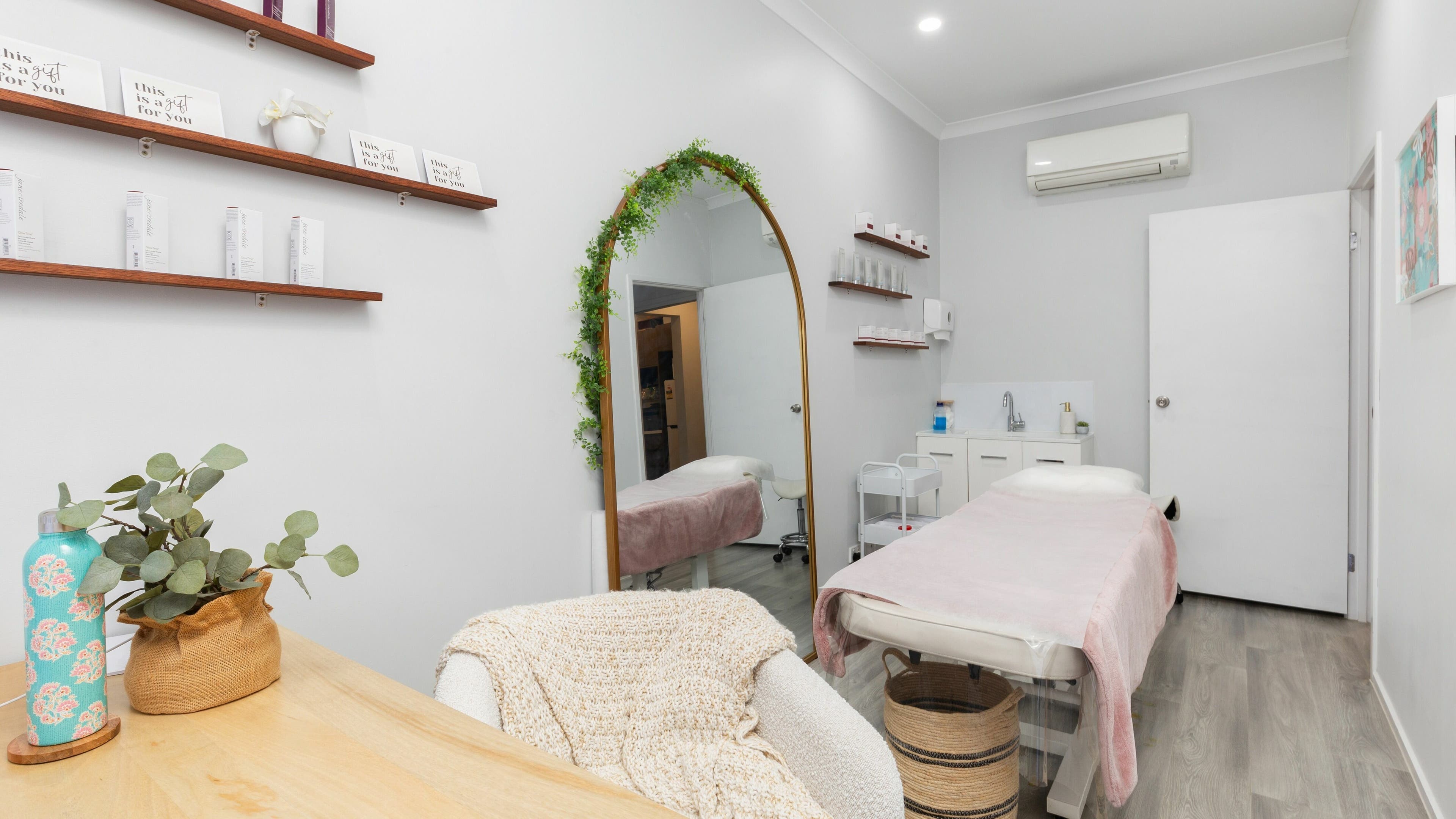 Tranquil treatment room at Fresh Face Australia in Oxenford, Queensland, AU with elegant decor and soothing ambiance.