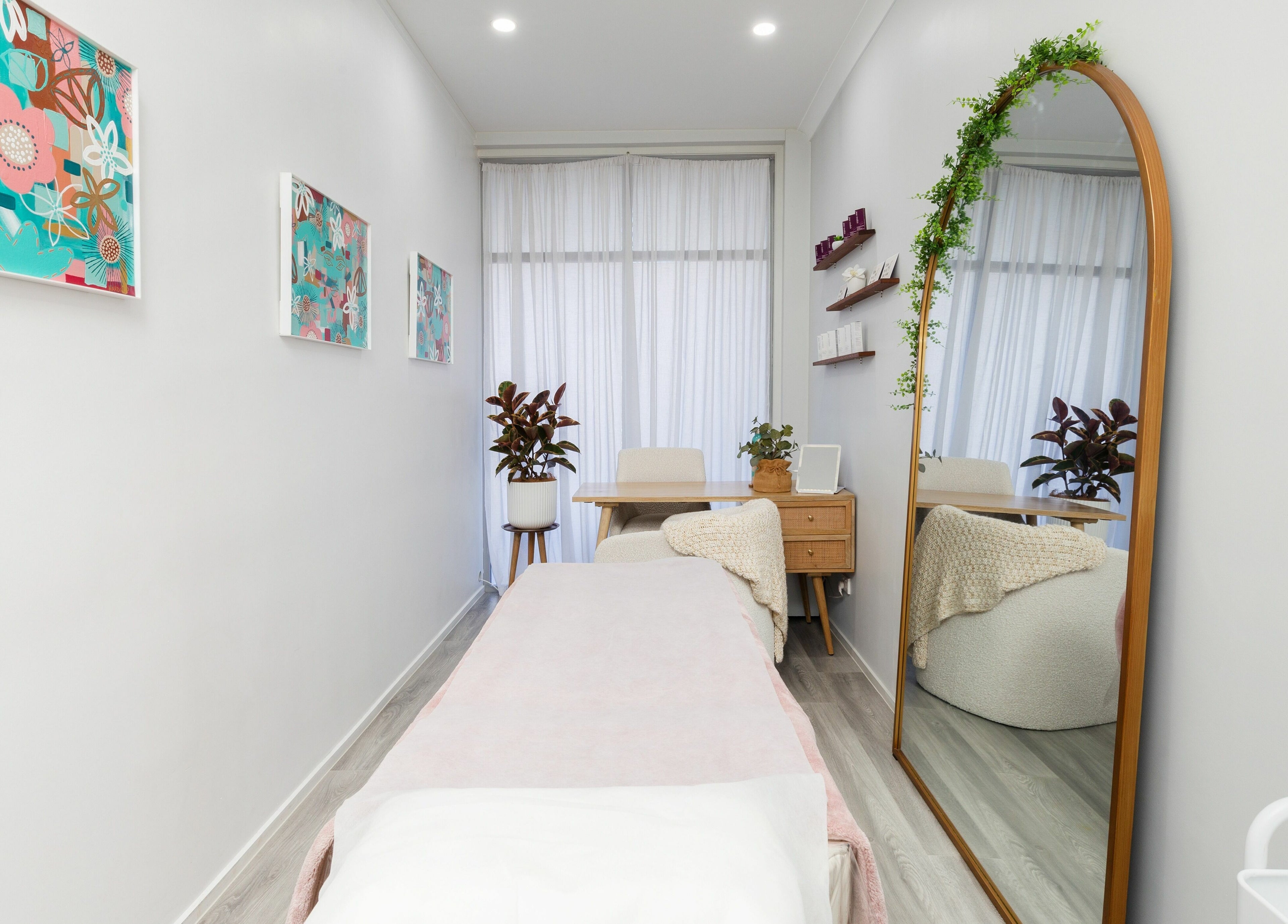 Relaxing treatment room at Fresh Face Australia, Oxenford, Queensland, AU, with stylish decor and comfortable seating.
