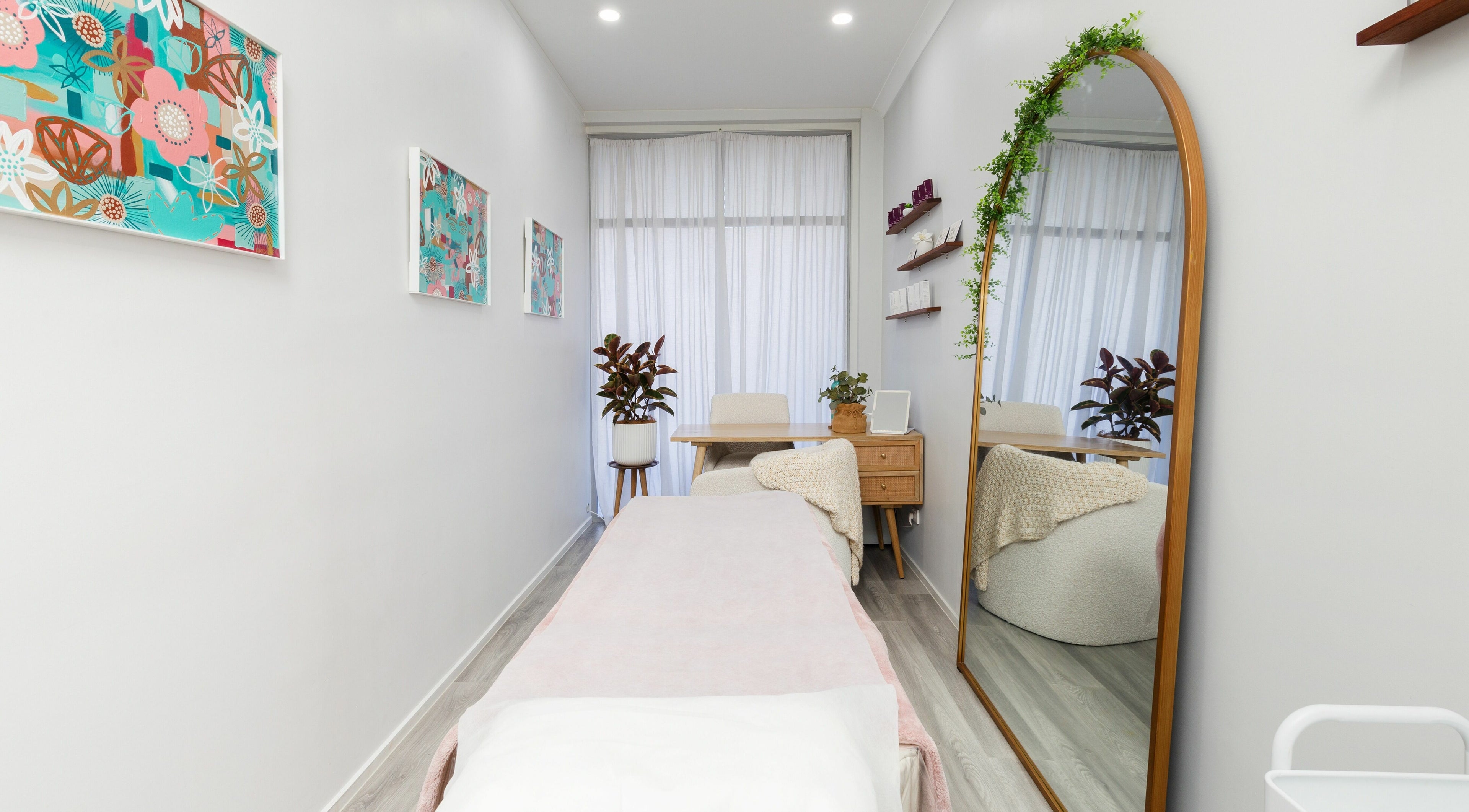 Relaxing treatment room at Fresh Face Australia, Oxenford, Queensland, AU, with stylish decor and comfortable seating.