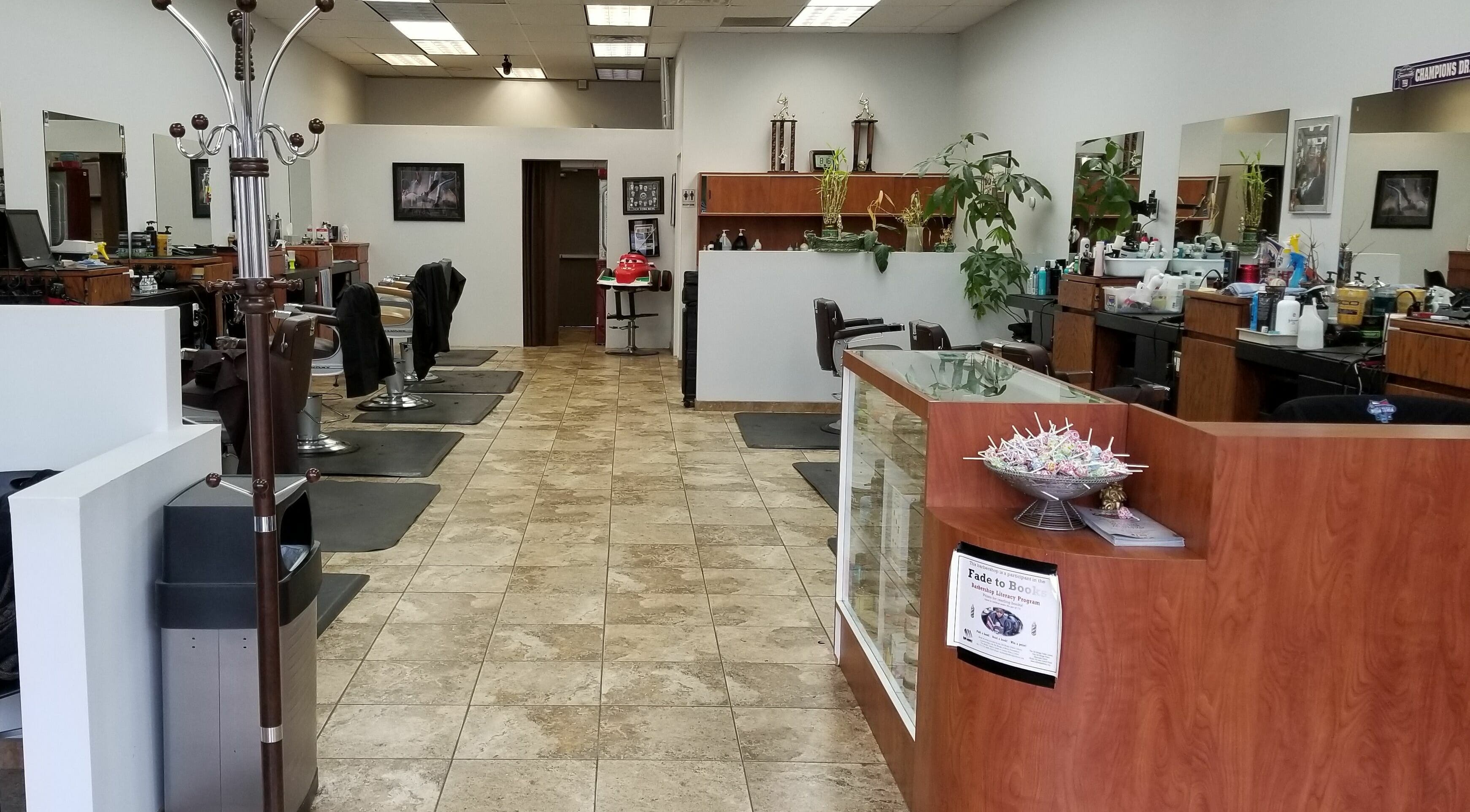 Interior of Anthony's Figaro Barber Shop in Old Bridge Township, New Jersey, US, showcasing stylish chairs and decor.