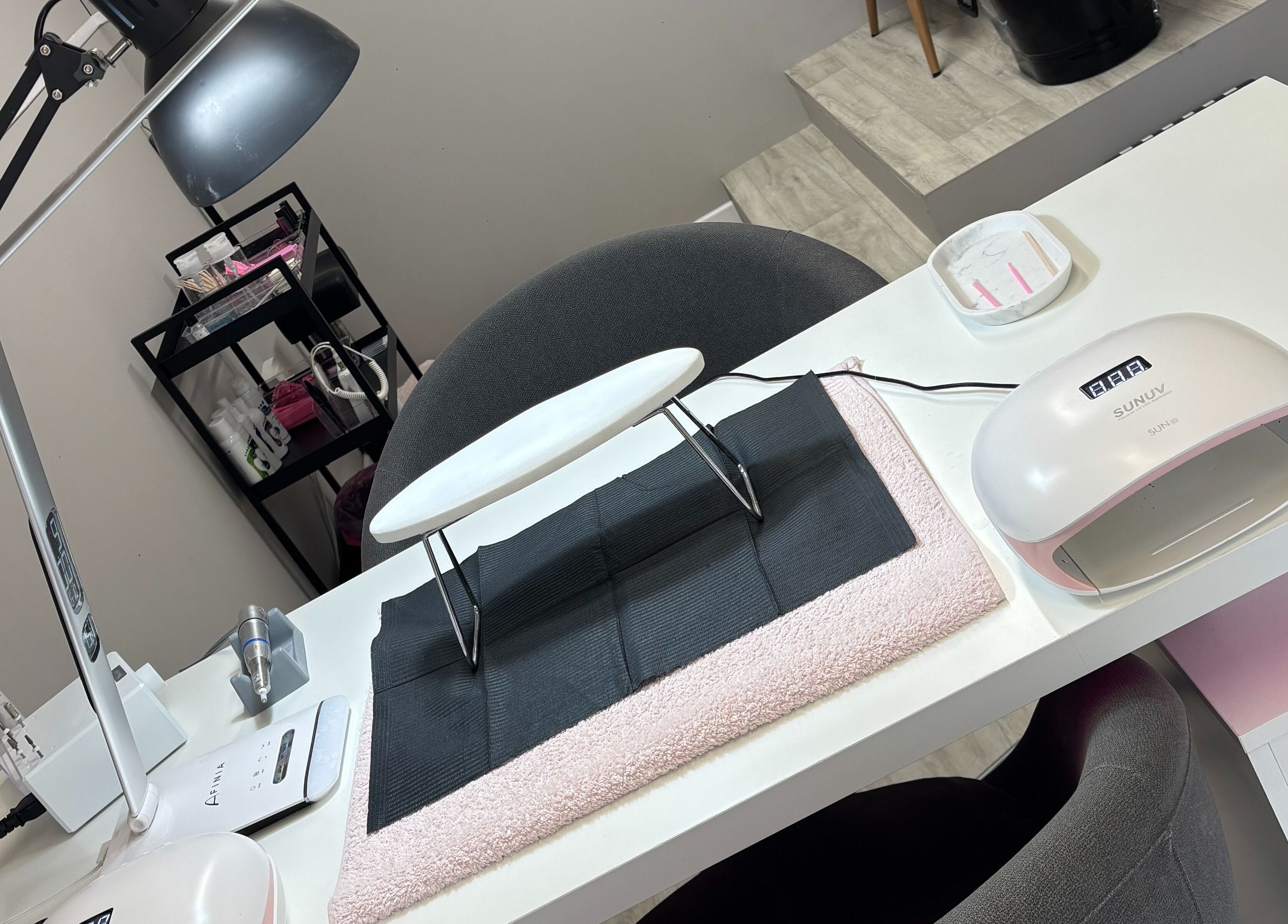 Nail station at Nails by Katelyn, Ardfinnan, IE with lamp and tools setup.