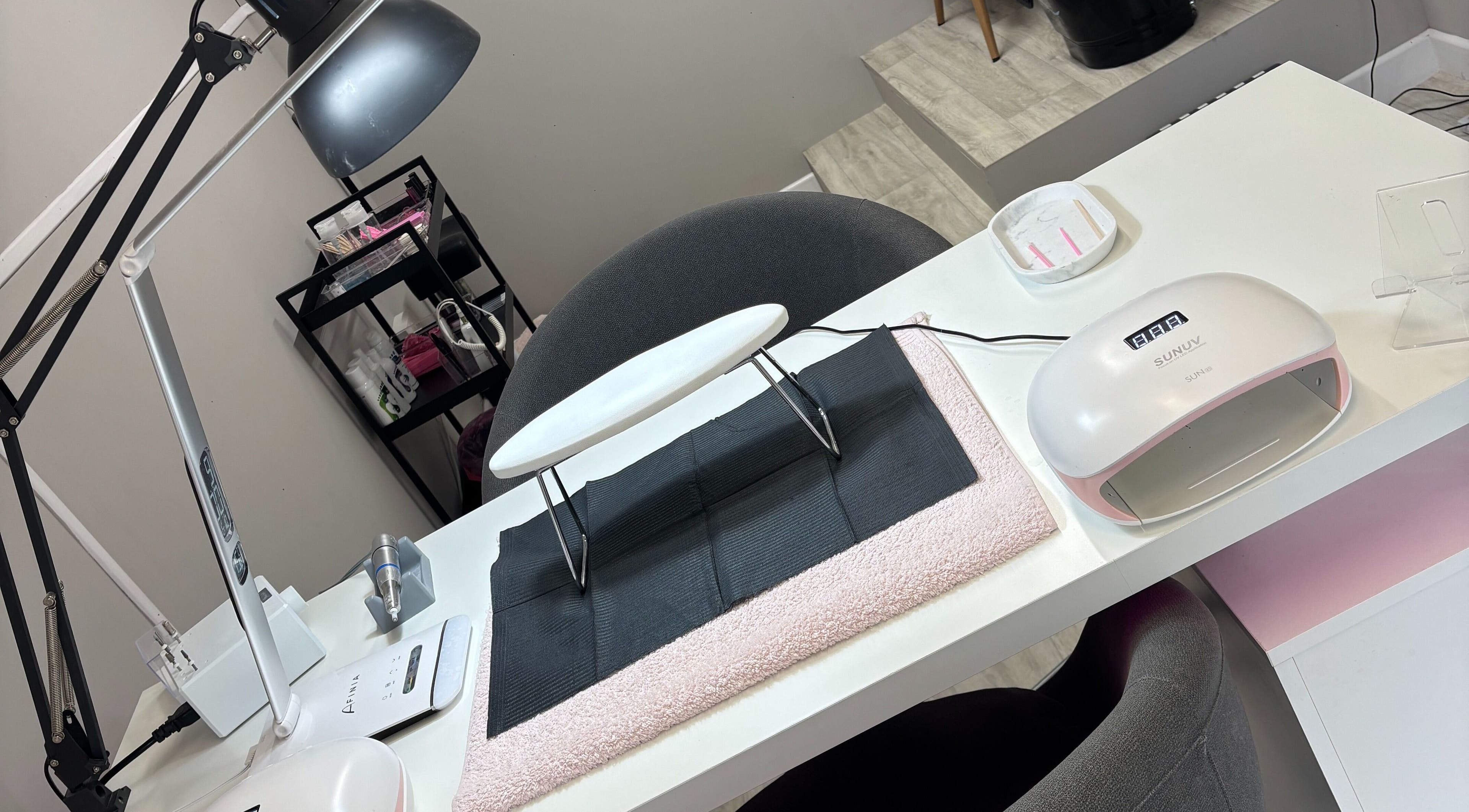 Nail station at Nails by Katelyn, Ardfinnan, IE with lamp and tools setup.