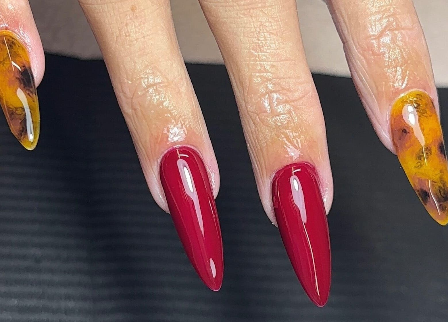 Bold nail art in vivid red and amber at Nails by Katelyn, Ardfinnan, IE.