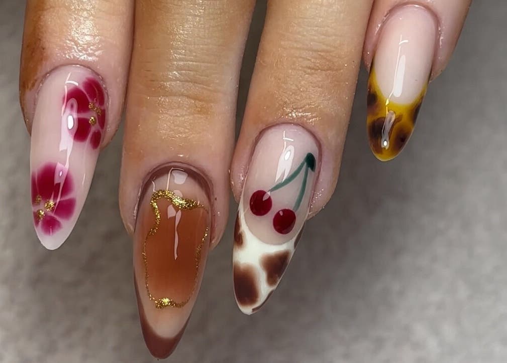 Stylish nail art designs at Nails by Katelyn in Ardfinnan, IE, featuring floral and cherry themes.