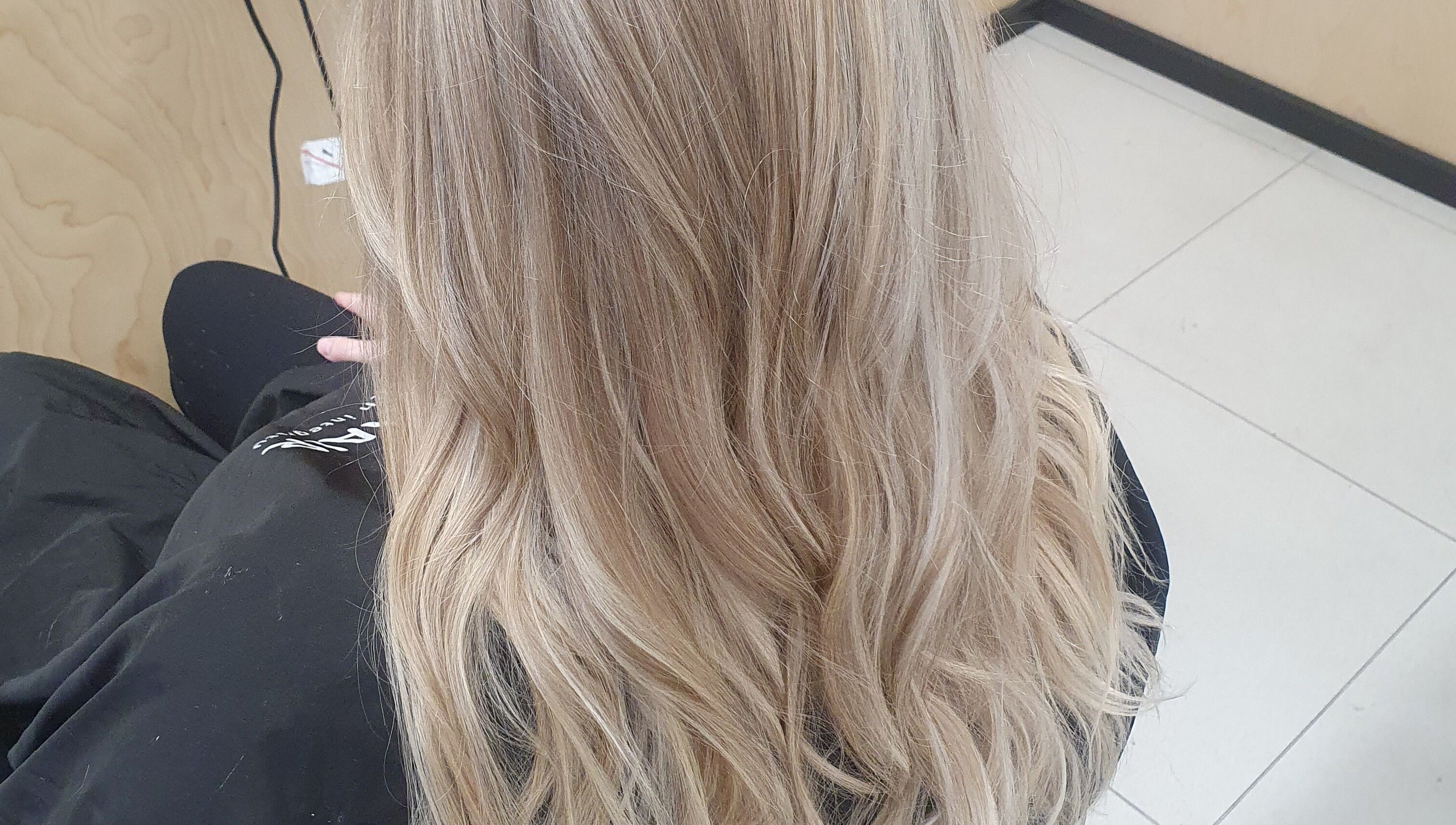 Elegant blonde hair styling at Colour By Case, Timaru, Canterbury, NZ. Perfect waves for a refined look.