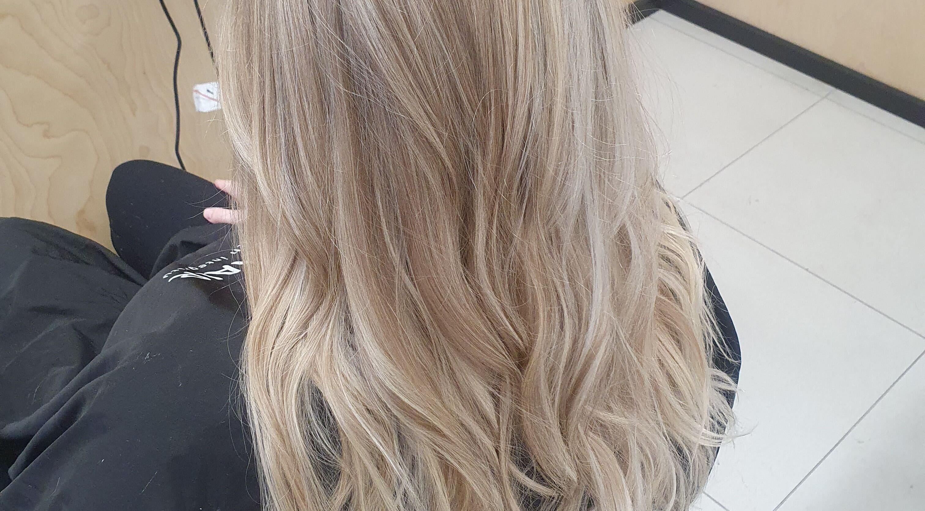 Elegant blonde hair styling at Colour By Case, Timaru, Canterbury, NZ. Perfect waves for a refined look.