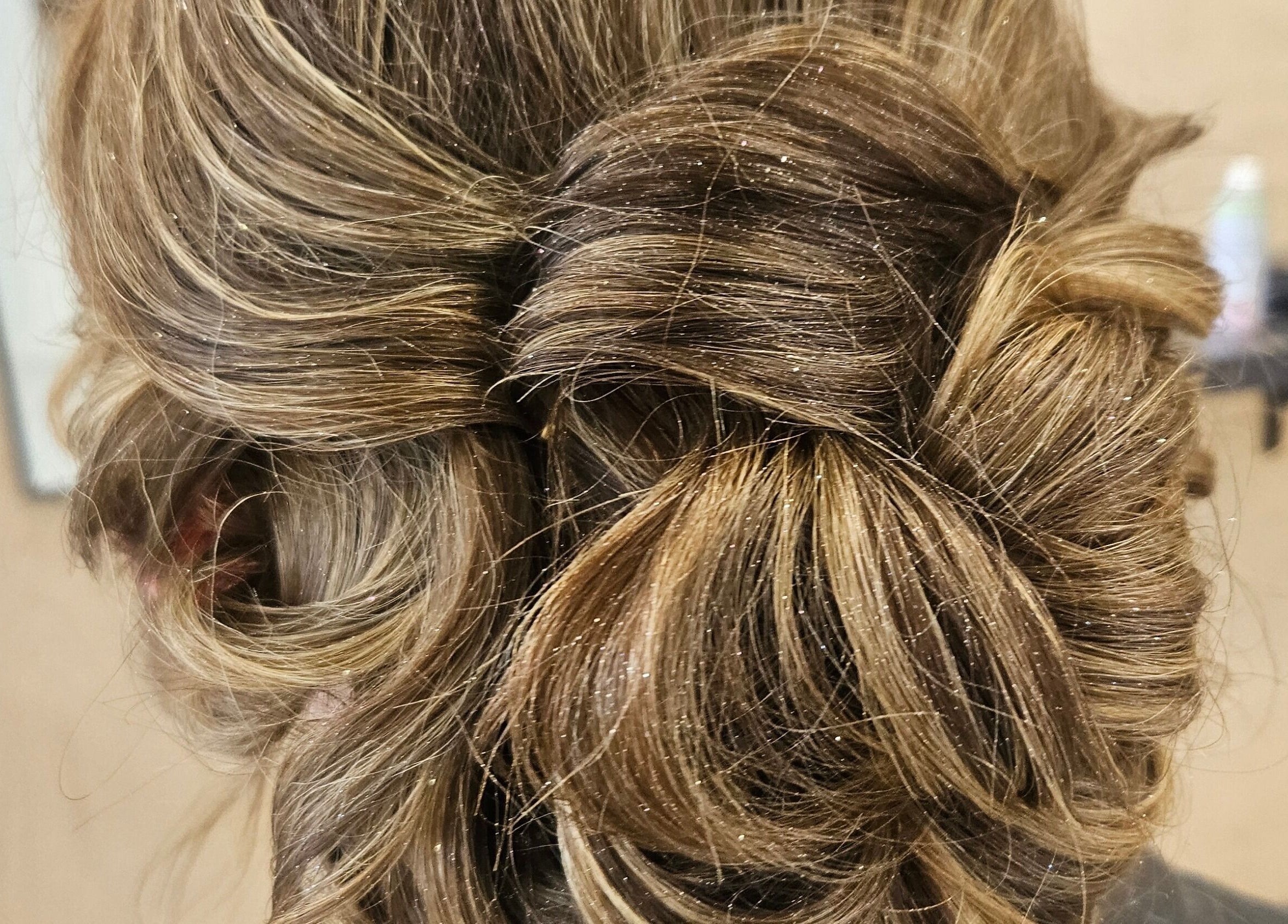 Elegant updo hairstyle at Colour By Case, Timaru, Canterbury, NZ, showcasing skillful styling.