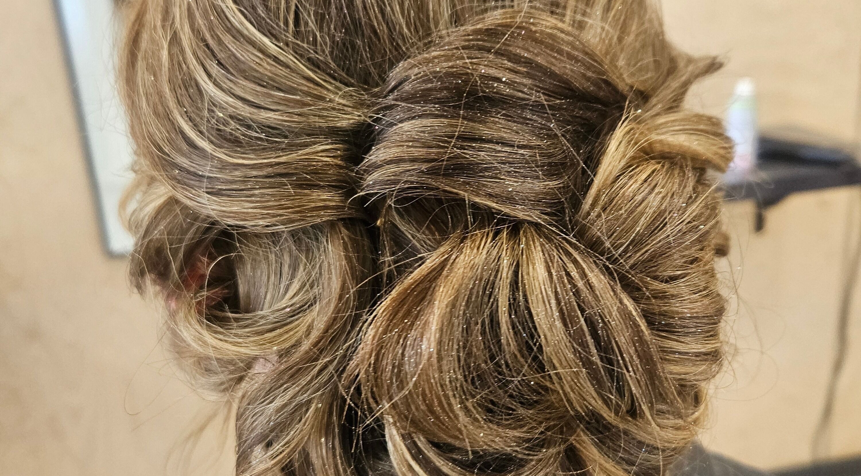 Elegant updo hairstyle at Colour By Case, Timaru, Canterbury, NZ, showcasing skillful styling.