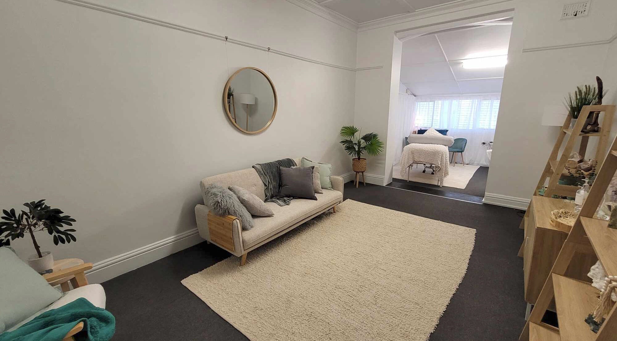 Tranquil seating area at Metamorphosis Awakening, Tweed Heads, New South Wales, AU, featuring cozy decor.