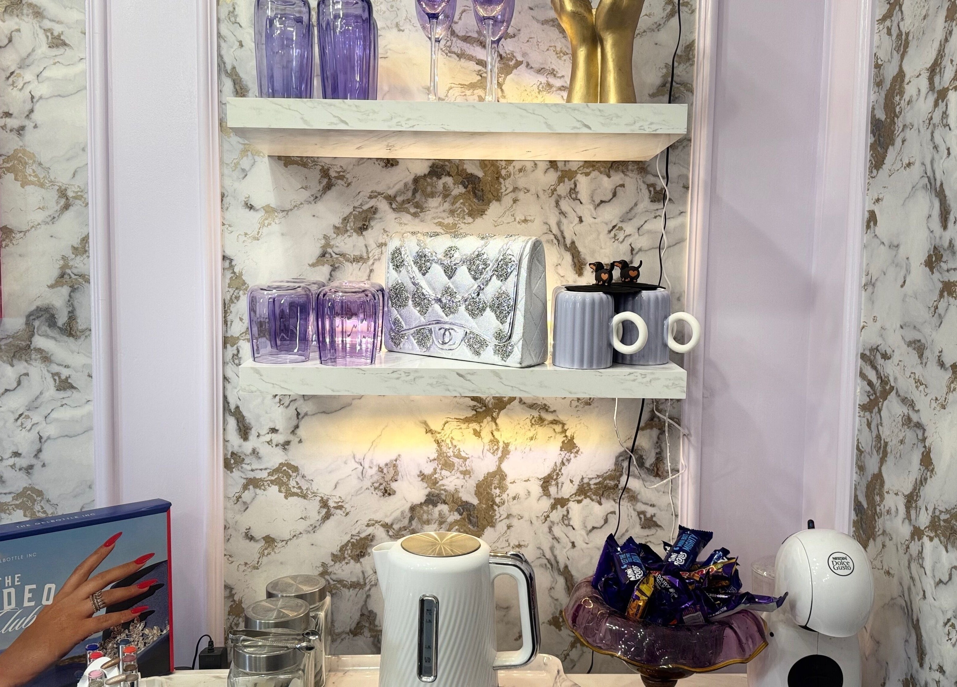 Elegant marble shelves at Plagued With Gelousy, 3A Watergate Arcade SY13 1DP, Whitchurch, England, GB.