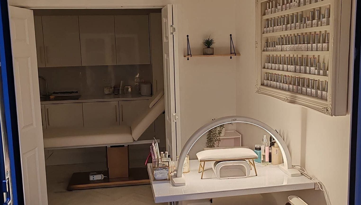 Interior of Blossom Beauty Academy, Beith, Scotland, featuring a modern nail station and serene ambiance.