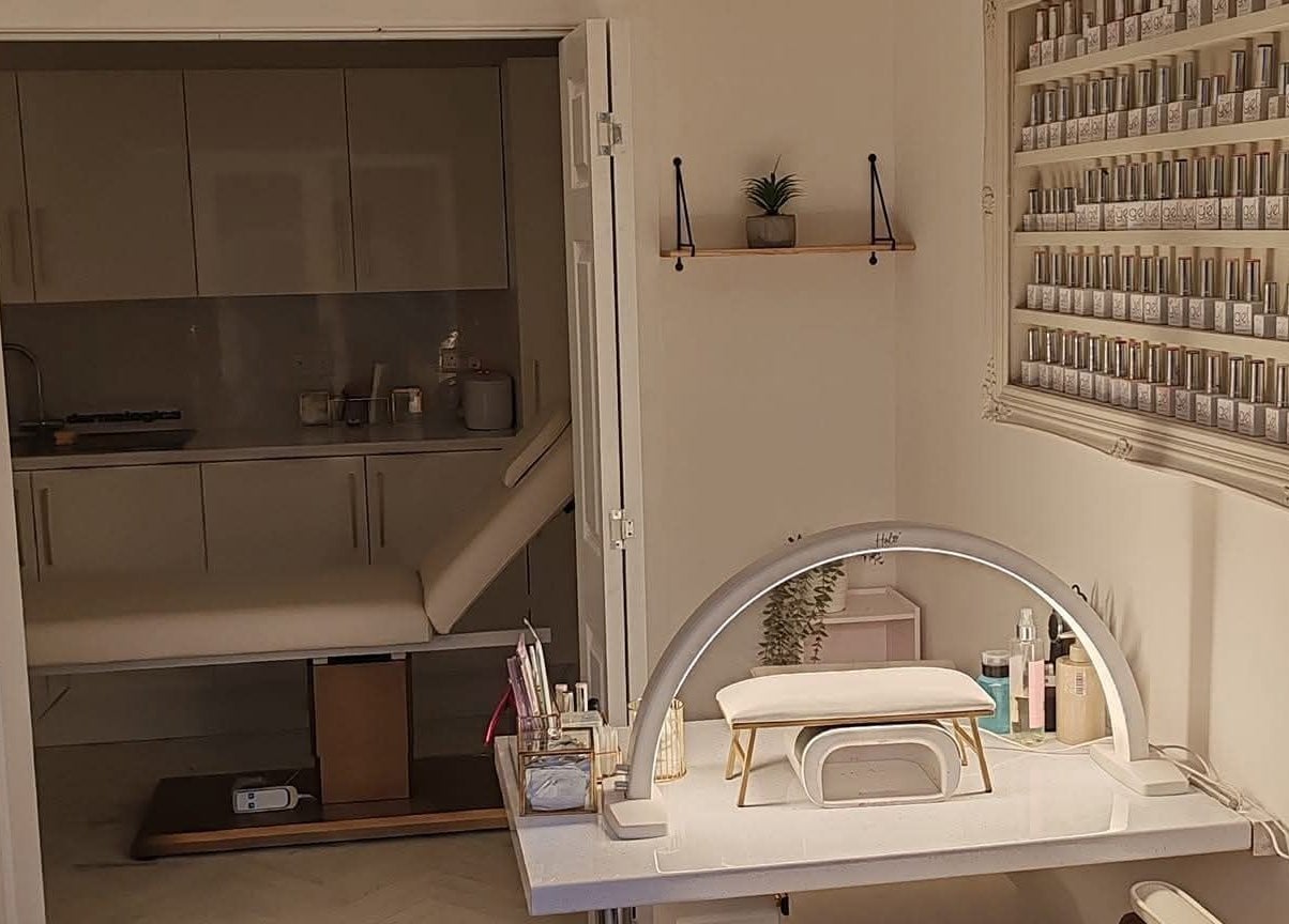 Interior of Blossom Beauty Academy, Beith, Scotland, featuring a modern nail station and serene ambiance.