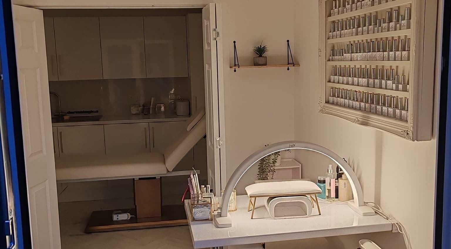 Interior of Blossom Beauty Academy, Beith, Scotland, featuring a modern nail station and serene ambiance.