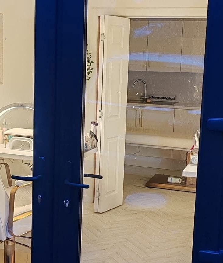 Interior of Blossom Beauty Academy in Beith, Scotland, GB showcasing elegant salon chairs and a serene setting.