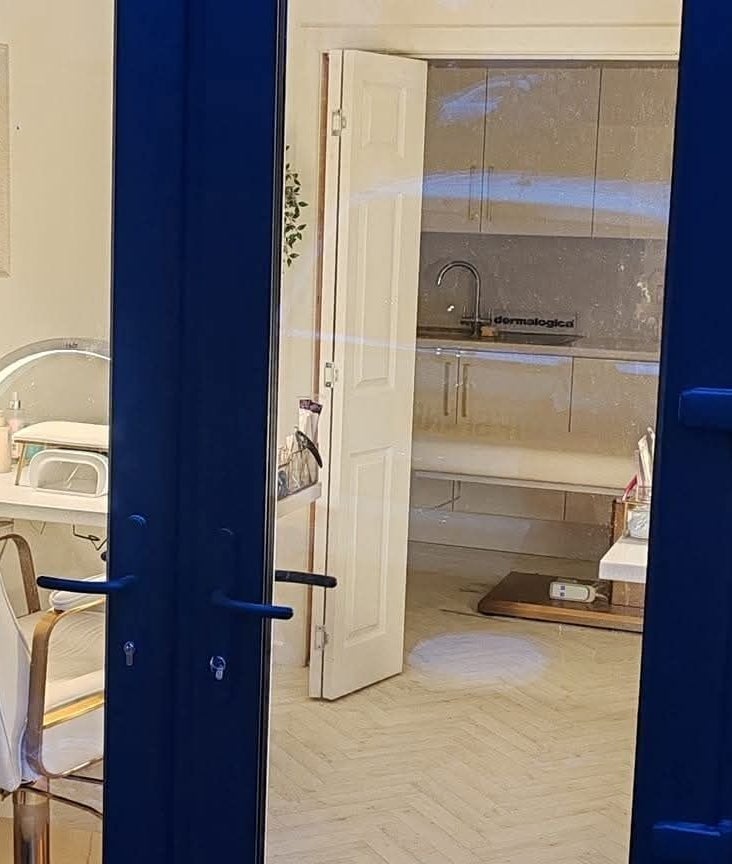 Interior of Blossom Beauty Academy in Beith, Scotland, GB showcasing elegant salon chairs and a serene setting.