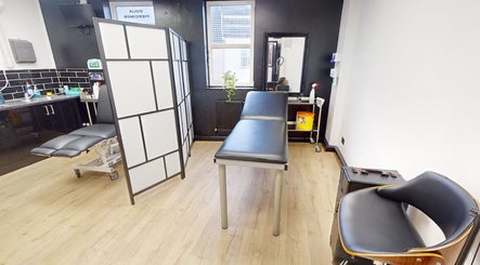 Relaxing room setup at Inka Studios, Derby, England, GB, with massage table and modern decor.