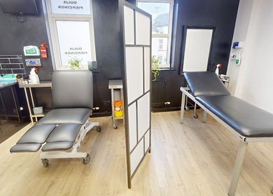 Professional treatment room at Inka Studios, Derby, England, GB showcasing modern piercing chairs and sleek decor.