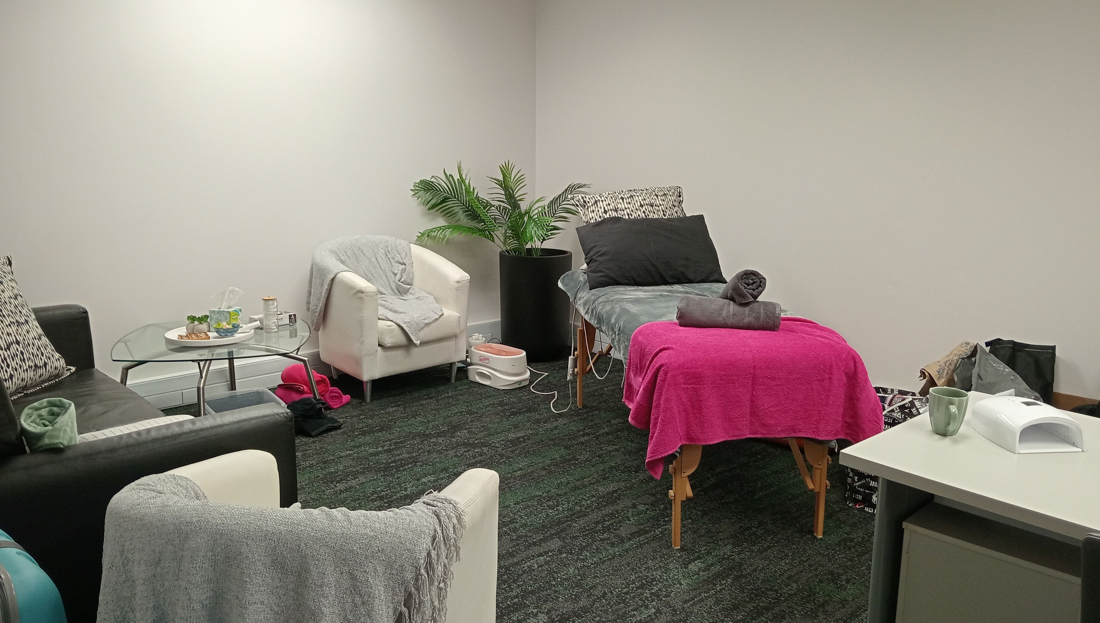 Relaxation room at ADG at Hensoldt Office in Irene, Centurion, Gauteng, ZA with cozy seating and a massage table.