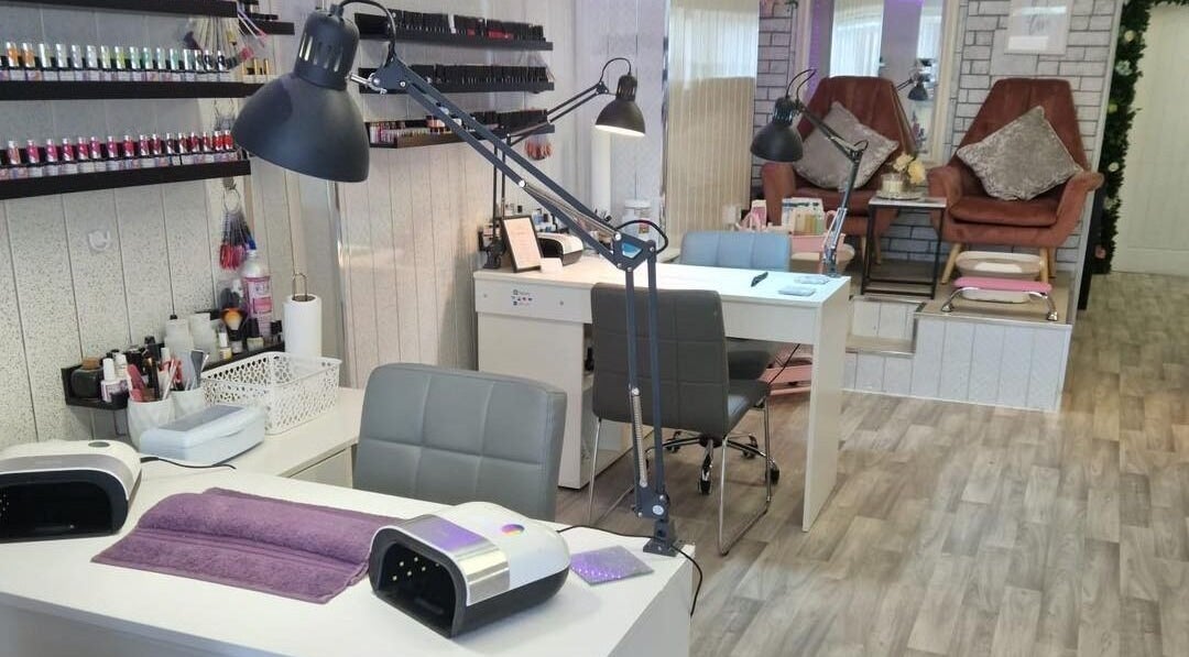 Modern interior of Glam and Glow Hair and Beauty Salon in Heath Hayes, England, GB showcasing elegant nail stations.