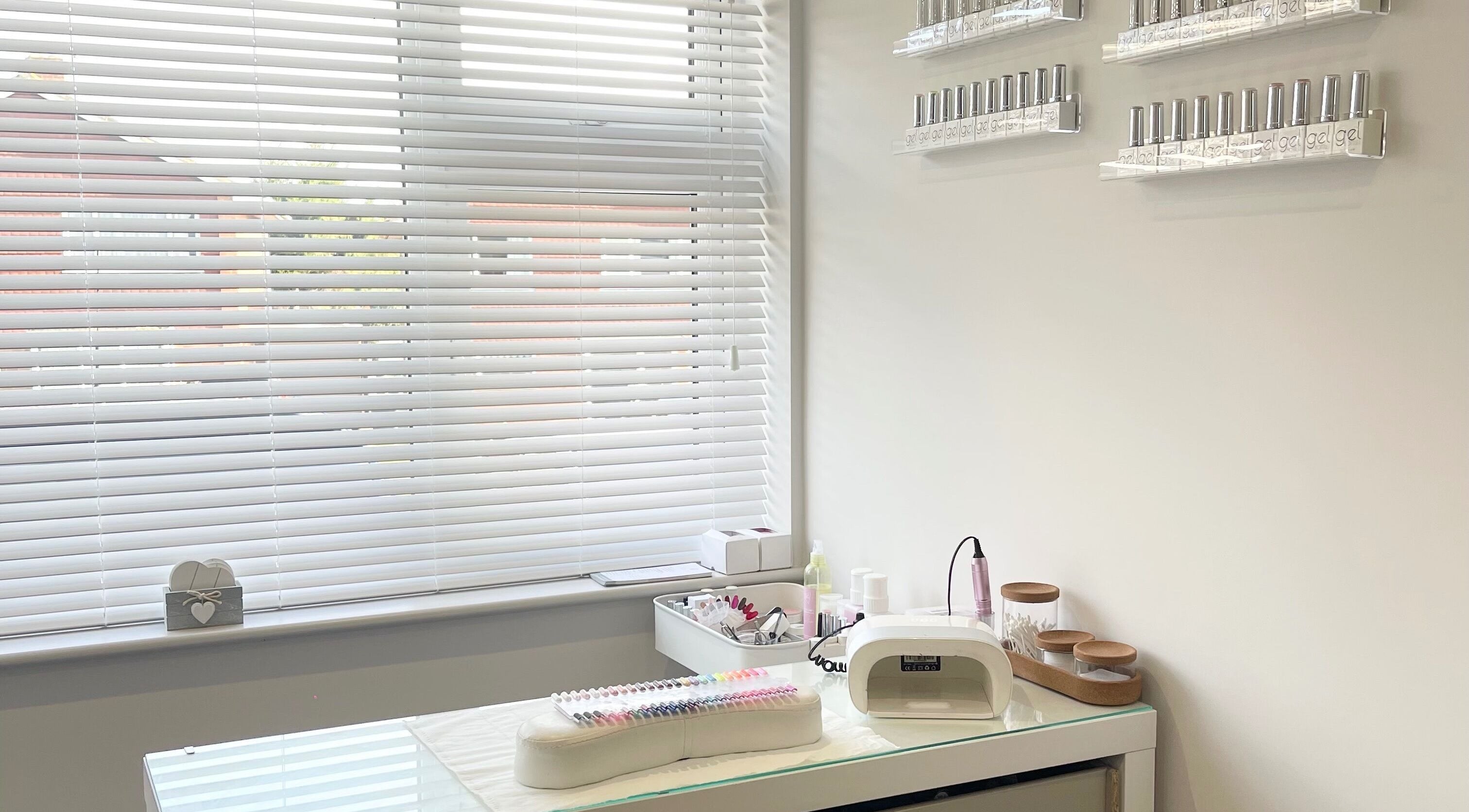 Nail station at Fleur’s Beauty UK, Winchester, England, GB equipped with gel polishes and manicure tools.