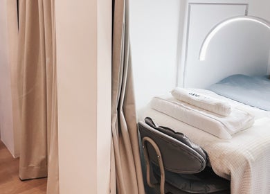 Tranquil treatment room at Cloud9 Beauty Bar (Bencoolen), Singapore, SG with cozy bed and soft lighting.