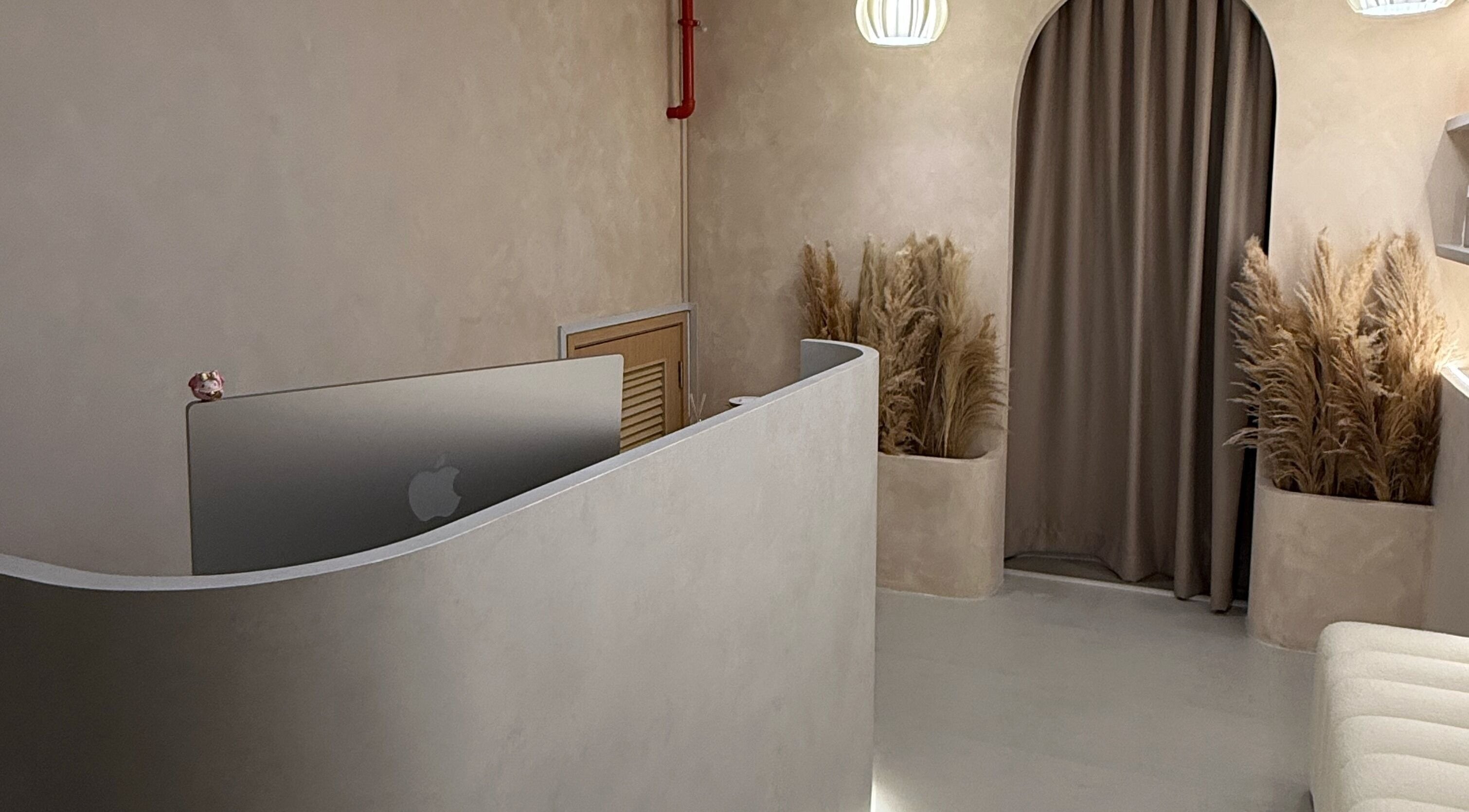 Elegant reception desk at Cloud9 Beauty Bar (Hougang), Singapore, SG welcomes visitors with minimalist decor.