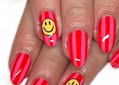 Bright striped manicure with smiley faces at Nailed It with Jess, Ledbury, England, GB.