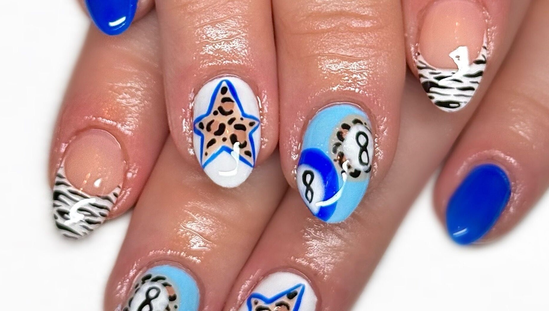 Unique nail art at Nailed It With Jess in Ledbury, England, GB, featuring stars, zebra stripes, and pool balls.