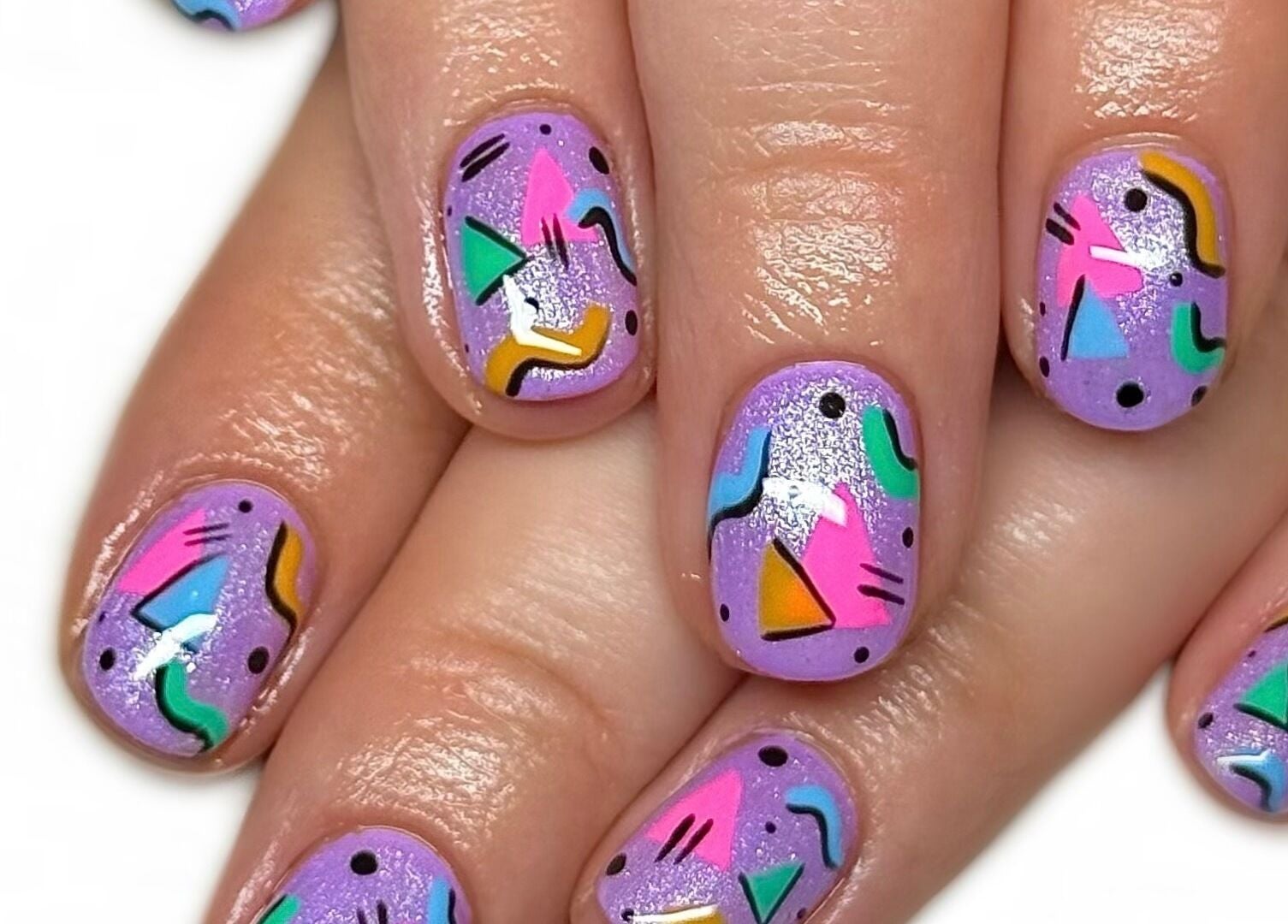 Colorful geometric nail art at Nailed It With Jess in Ledbury, England, GB, showcasing vibrant designs.