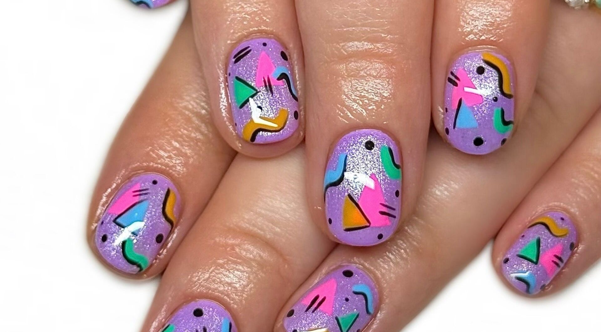 Colorful geometric nail art at Nailed It With Jess in Ledbury, England, GB, showcasing vibrant designs.
