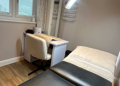 Beauty Box by Becky McDaid in Peterborough, England features a serene therapy room with a nail station.