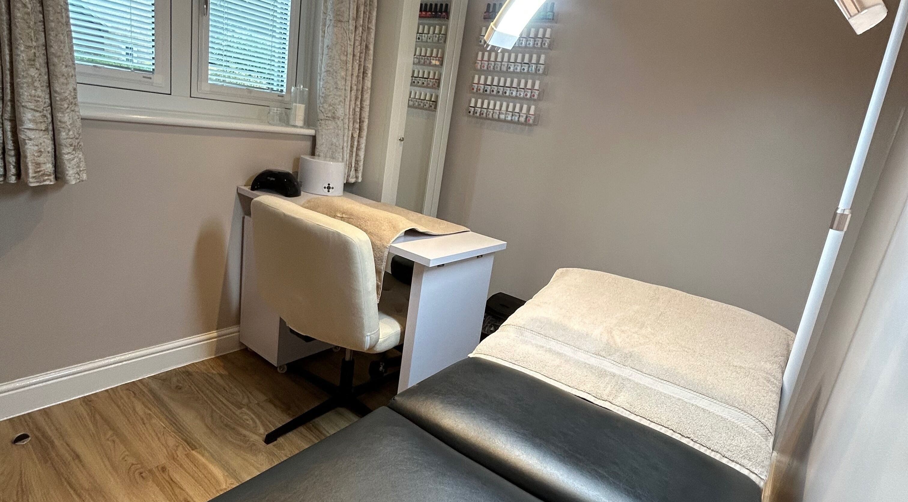 Beauty Box by Becky McDaid in Peterborough, England offers a serene beauty room with a treatment bed and nail station.