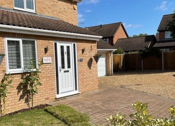 Exterior of Beauty Box by Becky McDaid in Peterborough, England, GB with brick facade and green plants.