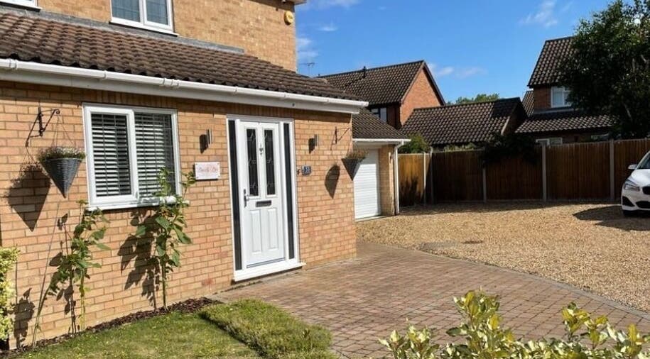 Exterior of Beauty Box by Becky McDaid in Peterborough, England, GB with brick facade and green plants.