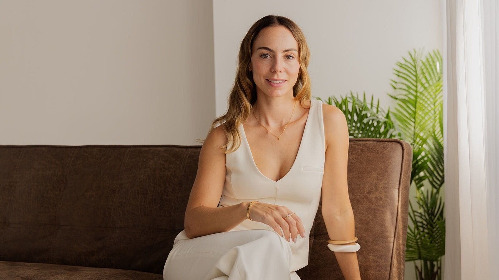 CS Aesthetic Injector Nurse Knowle Village seated in a serene, elegantly designed space in Knowle, England, GB.