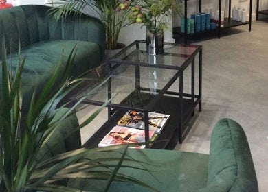 Cozy seating area at CS Aesthetic Injector Nurse, Southampton with green sofas and plants in Southampton, England, GB.