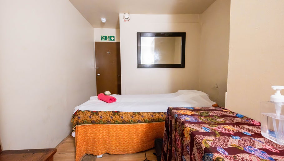 Relaxing massage room at Vavi Thai Massage Soho, London, England, GB, with vibrant decor and inviting ambiance.