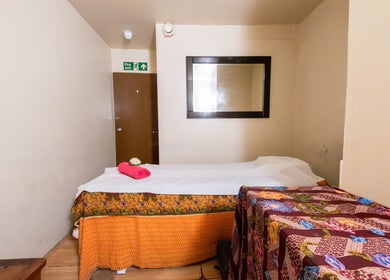 Relaxing massage room at Vavi Thai Massage Soho, London, England, GB, with vibrant decor and inviting ambiance.
