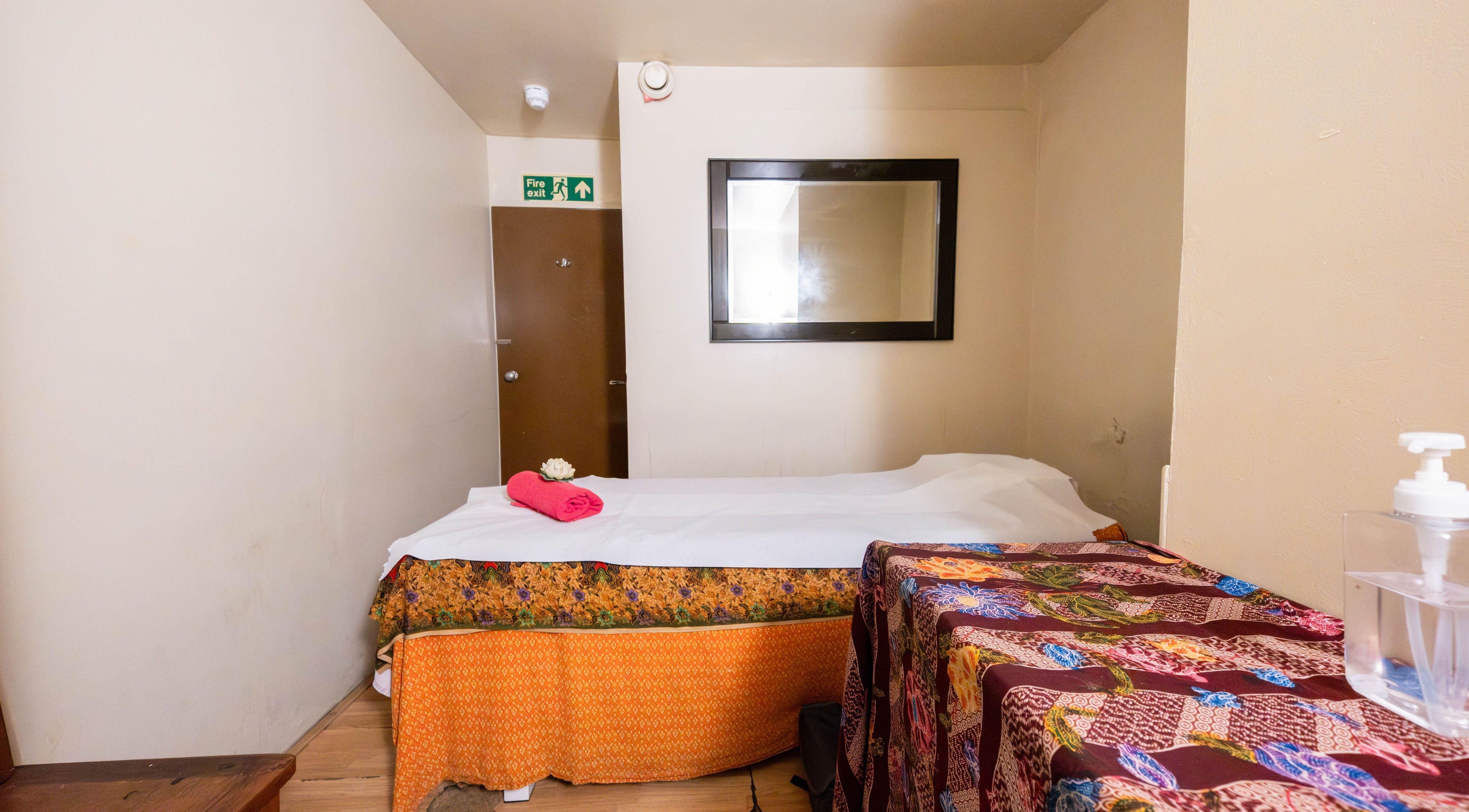 Relaxing massage room at Vavi Thai Massage Soho, London, England, GB, with vibrant decor and inviting ambiance.