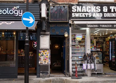 Entrance to Vavi Thai Massage Soho located in London, England, GB, nestled between shops.