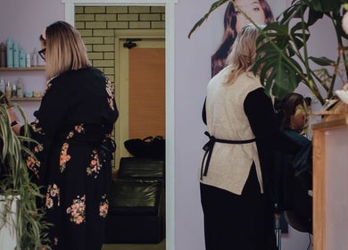 Stylists at Strawberri Blonde in action, Geeveston, Tasmania, AU. Modern interior with lush plants.