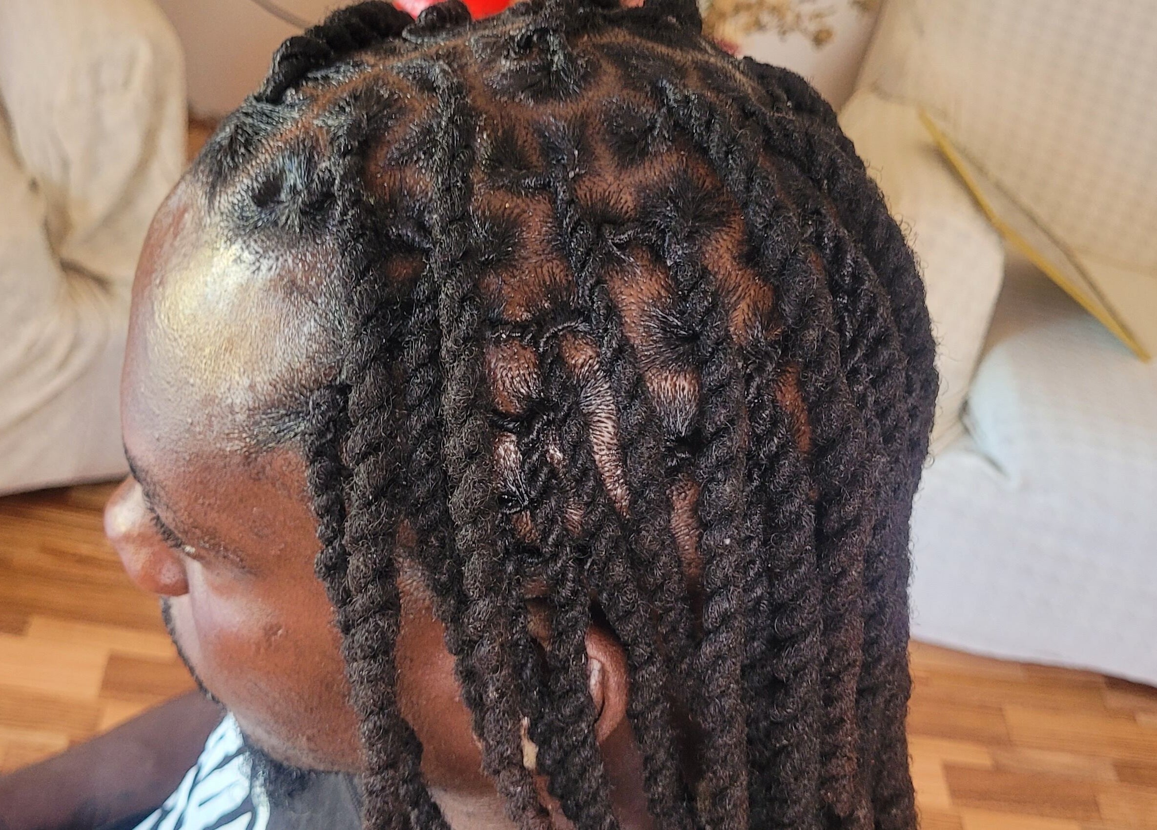 Intricate braided hairstyle at M'Shantelle Beautii, Speightstown, Saint Peter, BB showcasing expert styling.