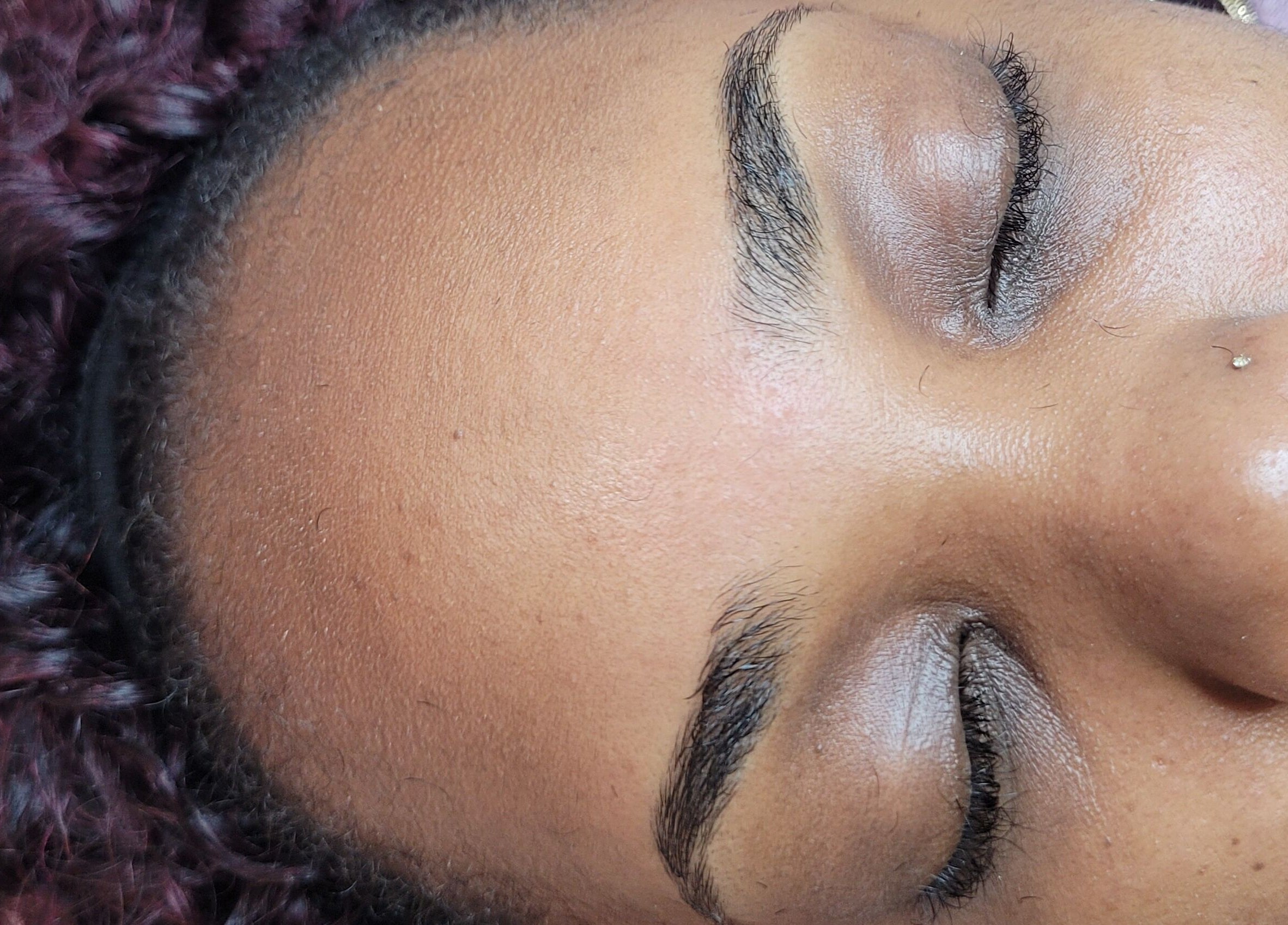 Close-up of a serene client with beautifully shaded eyes at M'Shantelle Beautii, Speightstown, Saint Peter, BB.