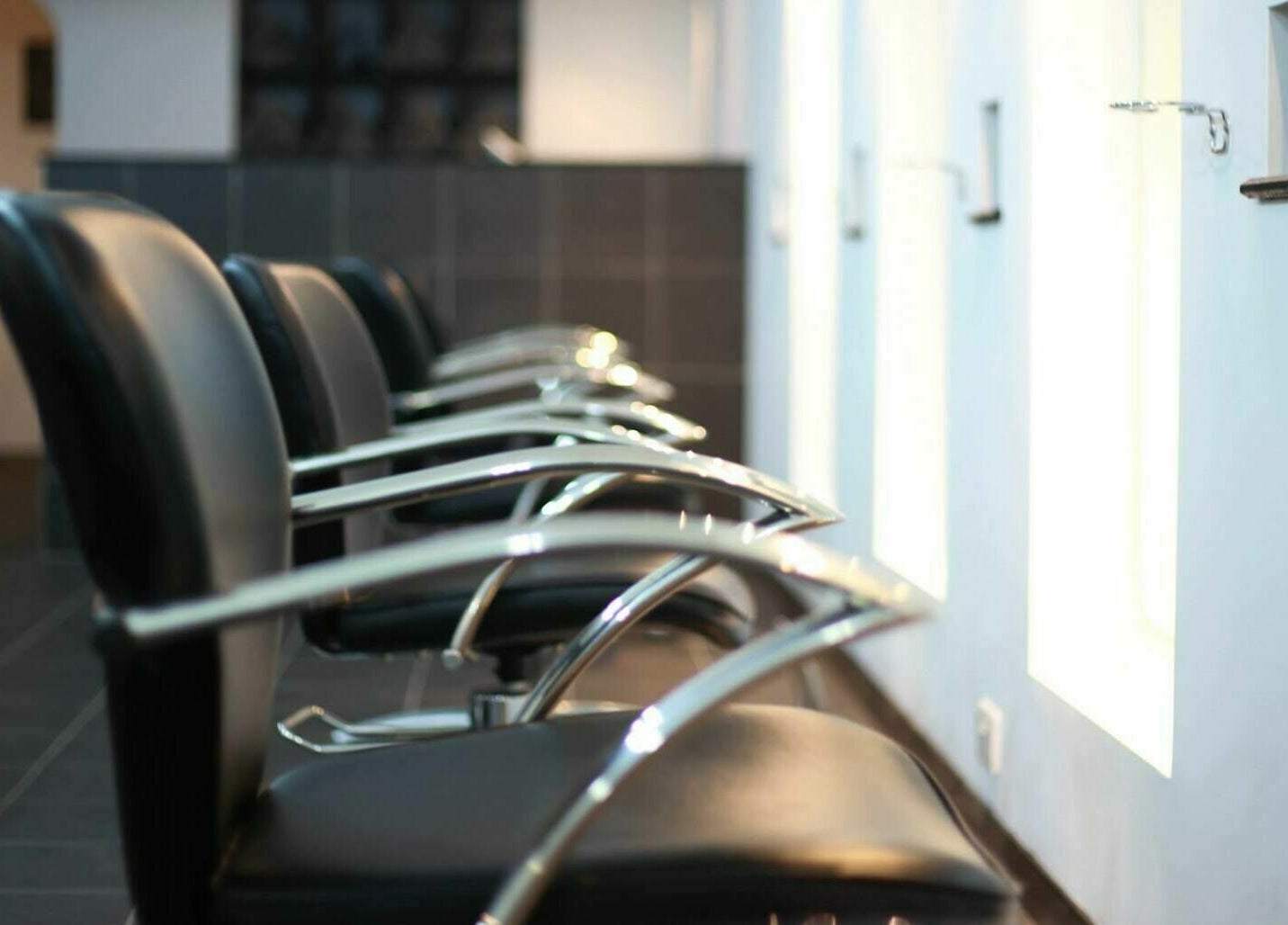 Modern salon chairs at Charlie Browns Hair Studio Ltd, Stoke-on-Trent, England, GB, showcasing sleek style.