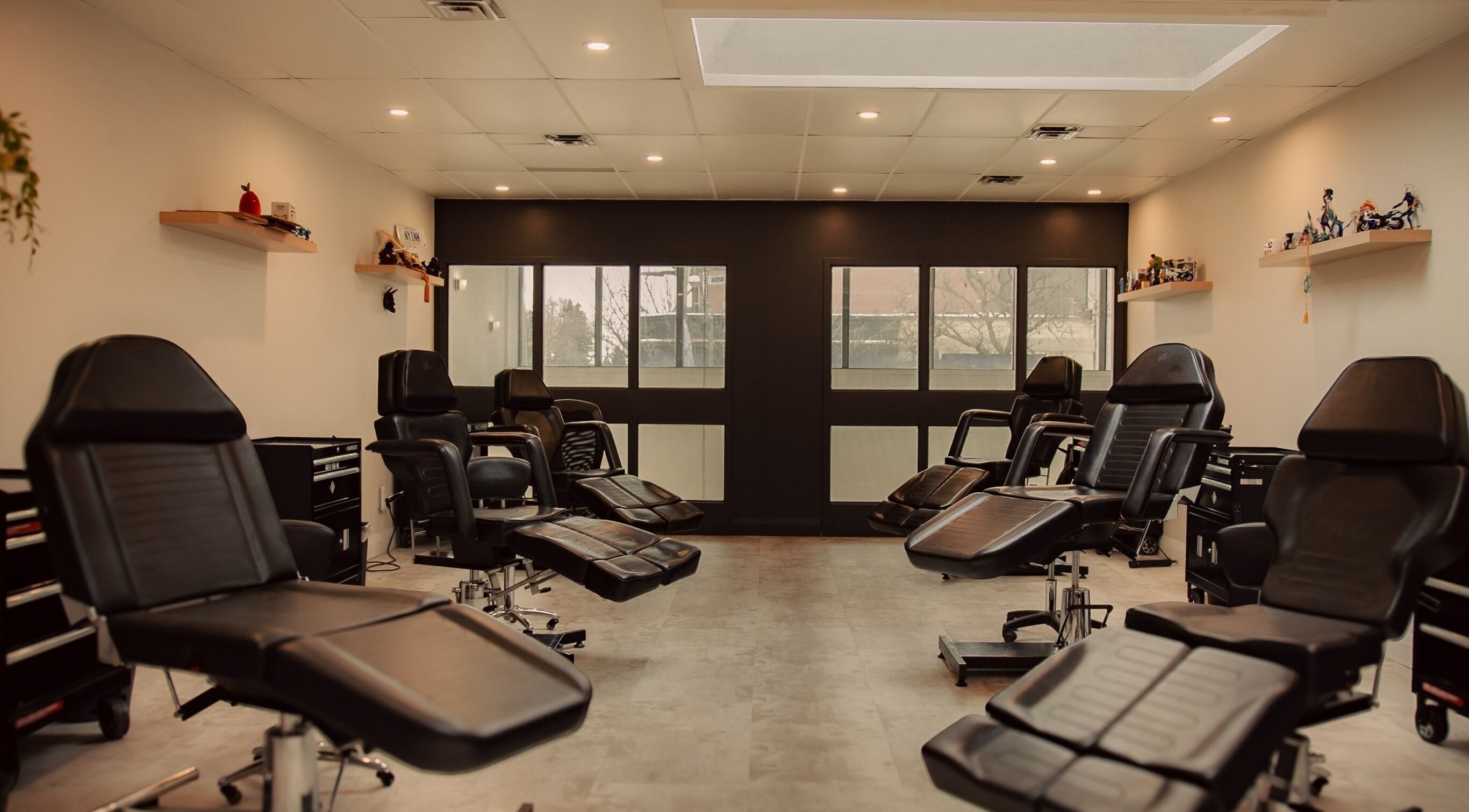 Spacious and modern tattoo studio interior at North York Ink, Toronto, Ontario, CA featuring comfortable chairs.