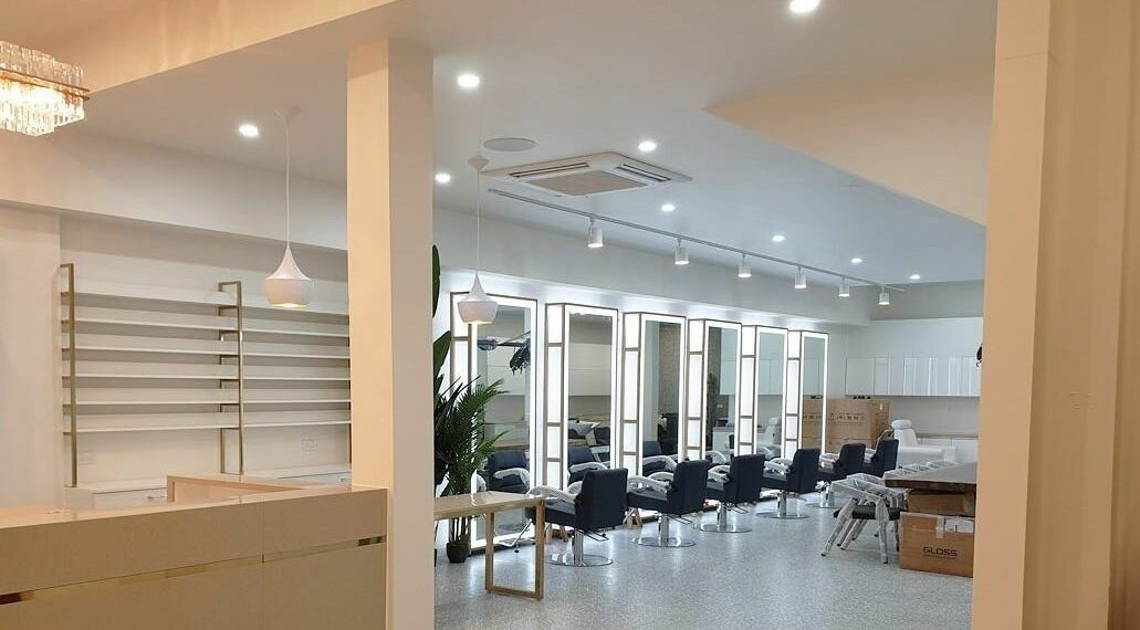 Modern salon interior at Foresta Hair - A'Beckett Street, Melbourne, Victoria, AU with sleek styling chairs.