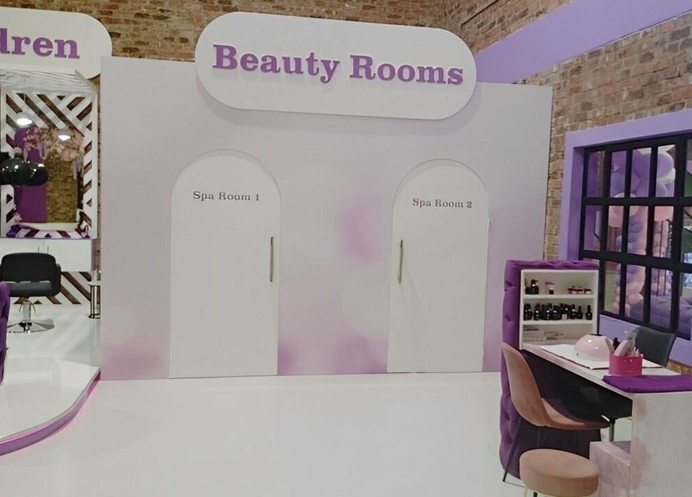 Beauty Rooms at Volumicious Riversands, Johannesburg, Gauteng, ZA with purple decor and spa rooms.