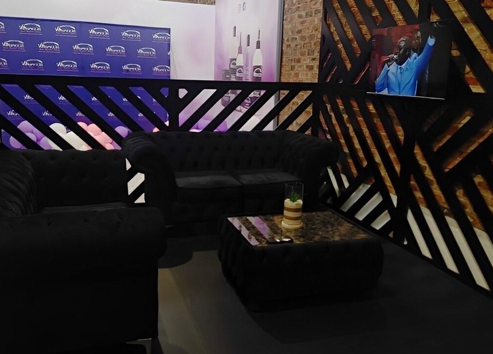 Stylish lounge at Volumicious Riversands, Johannesburg, Gauteng, ZA featuring plush seating and modern decor.