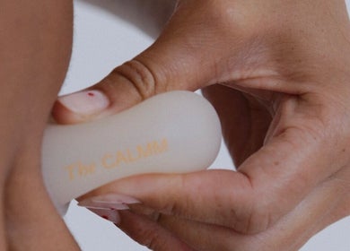 Hand using The Calmm massage tool at Lovedale, New South Wales, AU for relaxation therapy.